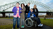 Gaz (Will Mellor, front) adjusts to life in a wheelchair (L-R: Luke Gell, Natalie Casey, Freddie Hogan and Georgia Henshaw)