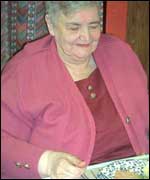 Woman eating lunch at Pensioners club in Wood End Community Centre 