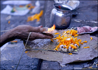 A Hindu man offers prayers on the last day of Pitrupaksha in Mumbai,