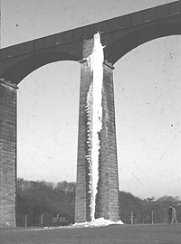 A giant icicle hangs from the aqueduct