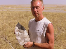 Professor David Thomas with a giant stone axe head found in dried base of Lake Mkgudikgudi