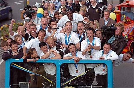 Torquay United team on bus for parade