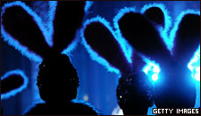 Silhouettes of people wearing rabbit ears