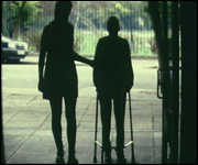 Eldery person walking with zimmer frame