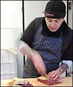 Julian Hodge chopping meat