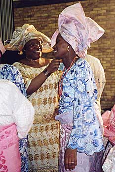 The bride is 'sprayed' with money photo © Maud Hand