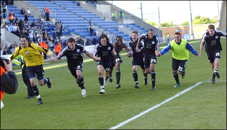 Posh players in victory slide, copyright Joe Dent