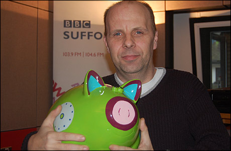 James Hazell and a piggy bank