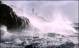 Stormy seas smashing up against cliffs - Photo by  Brian Morgan