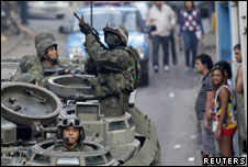 Soldiers patrol a favela