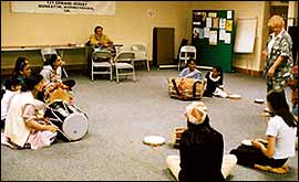 Learning to play the dhol drum 