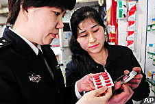 Health officials in China checking the toxic capsules