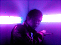 Ryan points at a bug in the Love Motel 