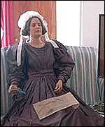 Model in  1830s costume inside Red House