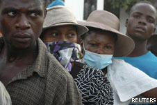 People in Haiti wait outside a hospital