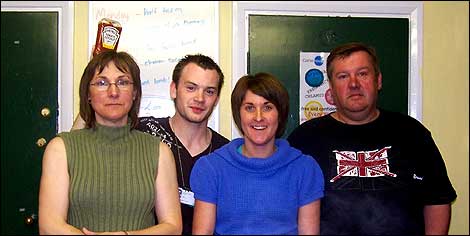 Four people in a youth centre