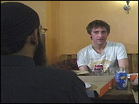 Sam sharing a pizza and learning about Islam