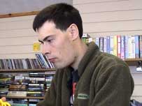 Chris Burns working in a charity shop