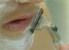 Teenage boy shaving