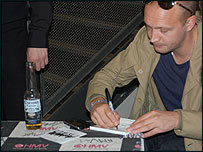 Frontman Phil Etheridge signs autographs for fans