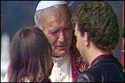 Pope John Paul II blessing a married couple