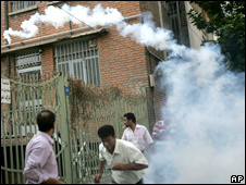 Supporters of opposition leader Mir Hossien Mousavi run from tear gas fired by riot police during a protest in Tehran on Saturday June, 20, 2009
