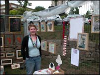 Debbie Thomas with her  colourful artwork