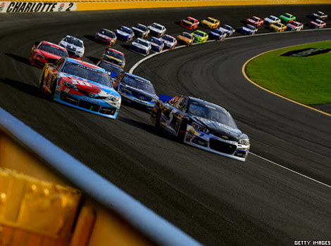 Cars drive round bend in a NASCAR race