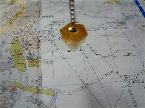 Map and dowsing crystal