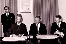 Colonel Everard signing the swearing in of his position as the Acting Officer Administering the Government 1971