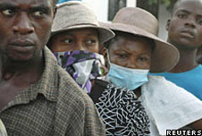 People wearing masks during cholera outbreak in Haiti