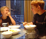 Boys eating rice