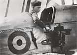 An observer of the Royal Flying Corps in a BE2c reconnaissance aircraft demonstrating a C-type aerial reconnaissance camera fixed to the side of the fuselage
