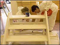 Volunteers painting steps