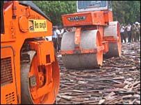 Bulldozers cruching the firearms (photo Elmo Fernando)