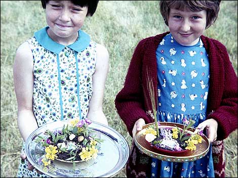 Two girls holding pieces of art 470