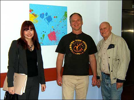 People standing near some artwork 470