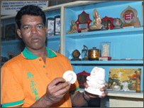 Damaged Buddha statue