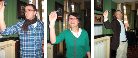 Jon, Ally and James prepare to throw their darts
