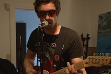 Guitarist from a French rock band singing