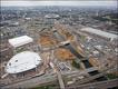 Vista aérea do Parque Olímpico, com o Velódromo à esquerda, a arena do basquete em frente, e o centro de imprensa à direita © ODA 2008