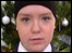Schoolgirl  in front of christmas tree