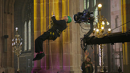 Seven Ages Of Britain: David Dimbleby being winched up to a medieval painting in Holy Trinity Church, Coventry