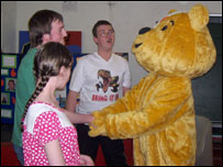 Pudsey bear shaking hands