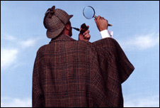 An actor dressed as Sherlock Holmes