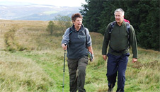 Kerry and Derek walking across a field