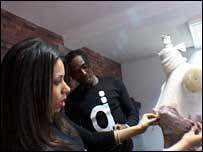 Eugene Dadi and Joana Varela da Veiga dressing a mannequin