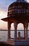 Hindu shrine in Delhi, India, at sunrise looking out over the waters