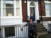 Woman standing outside a house in Hull 203