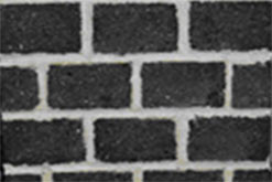 close up of bricks made out of rubbish forming part of a wall